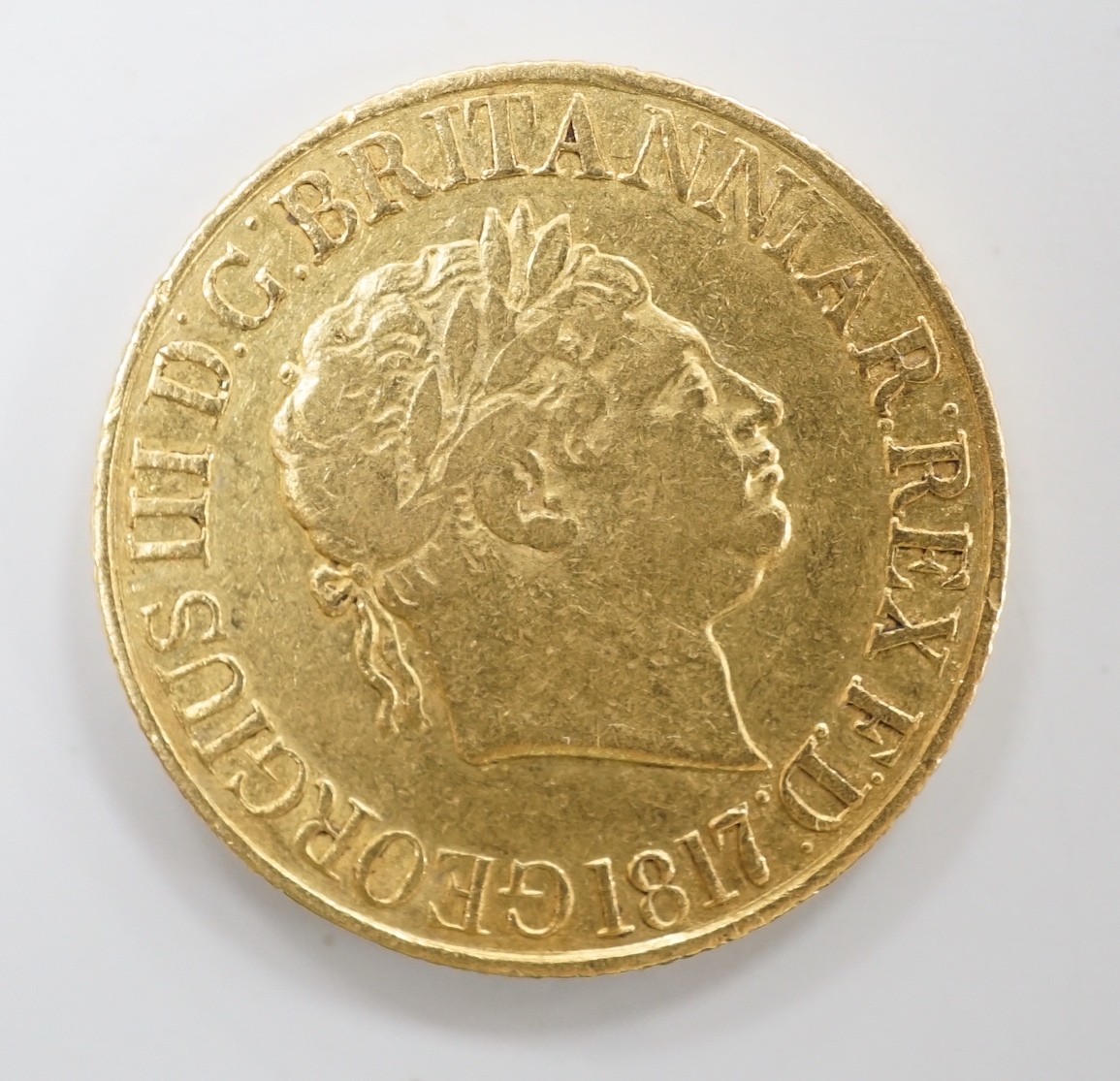 A George III 1817 gold sovereign, about VF.